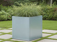 CUBY quadratischer Pflanzkübel aus verzinktem Stahl mit Ziergras im Garten